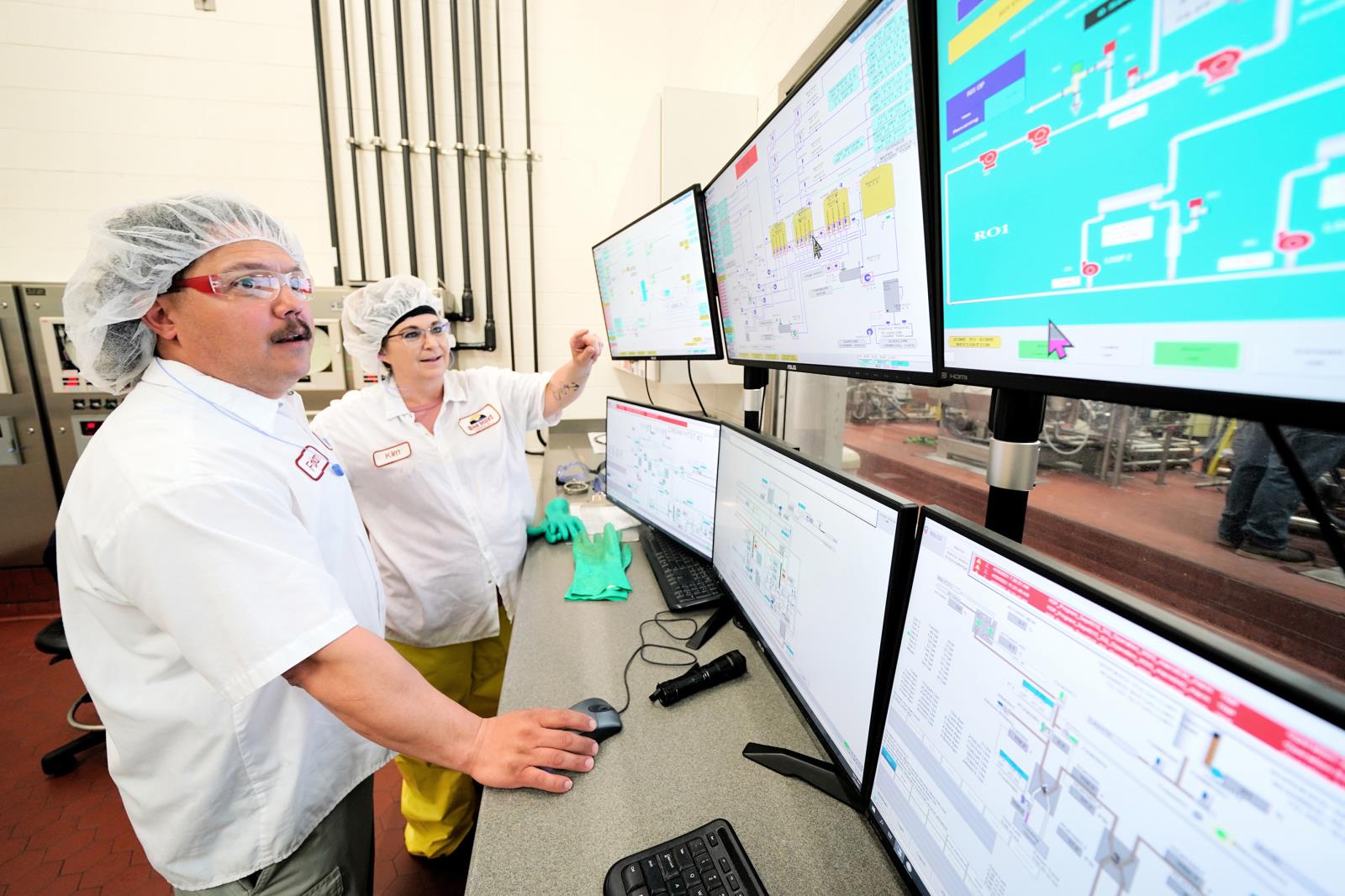 High Desert Milk employees Fabian Beltran and Kim Espinoza monitor processes in the control room of the cooperative’s Burley dairy processing facility July 28. The Burley-based cooperative, one of Idaho’s leading dairy processors, is undergoing a $50 million expansion that will nearly double its total output.