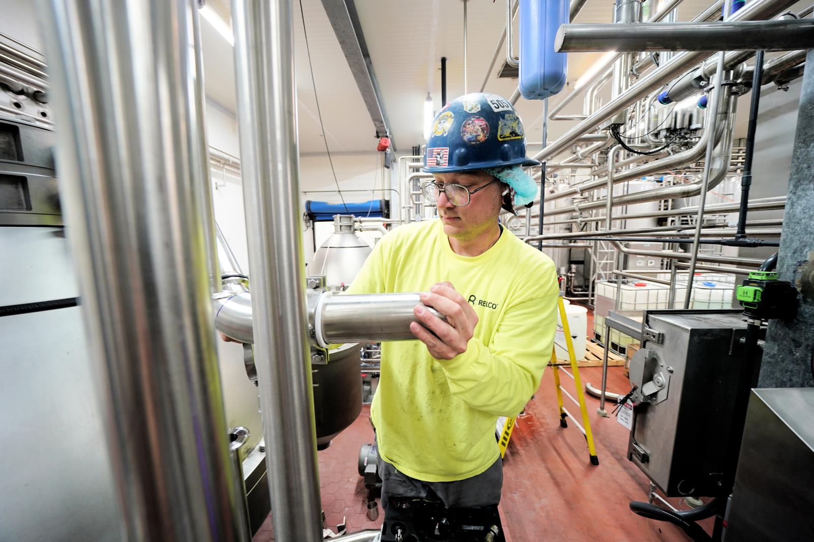 A contract construction worker installs piping for High Desert Milk’s new MPC-70 production line. The Burley-based cooperative, one of Idaho’s leading dairy processors, is undergoing a $50 million expansion at its Burley facility.
