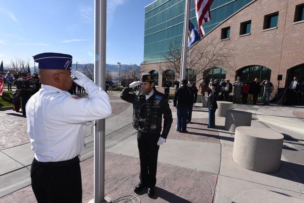 Veterans saluting the flags at presentation