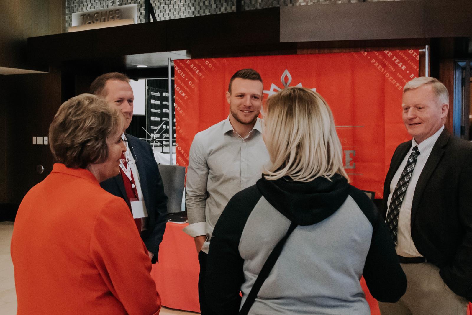 Pocatello native and NFL player Taysom Hill, center, speaks to Farm Bureau Mutual Insurance Co. of Idaho insurance agents in February. Hill is teaming up with the Idaho Potato Commission to help promote the state’s most famous commodity. 
