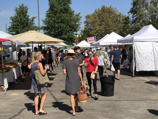 People shop at the Boise Farmers Market during a Saturday in August. Vendors say the market’s move to a new location this year has worked out better than they could imagine.