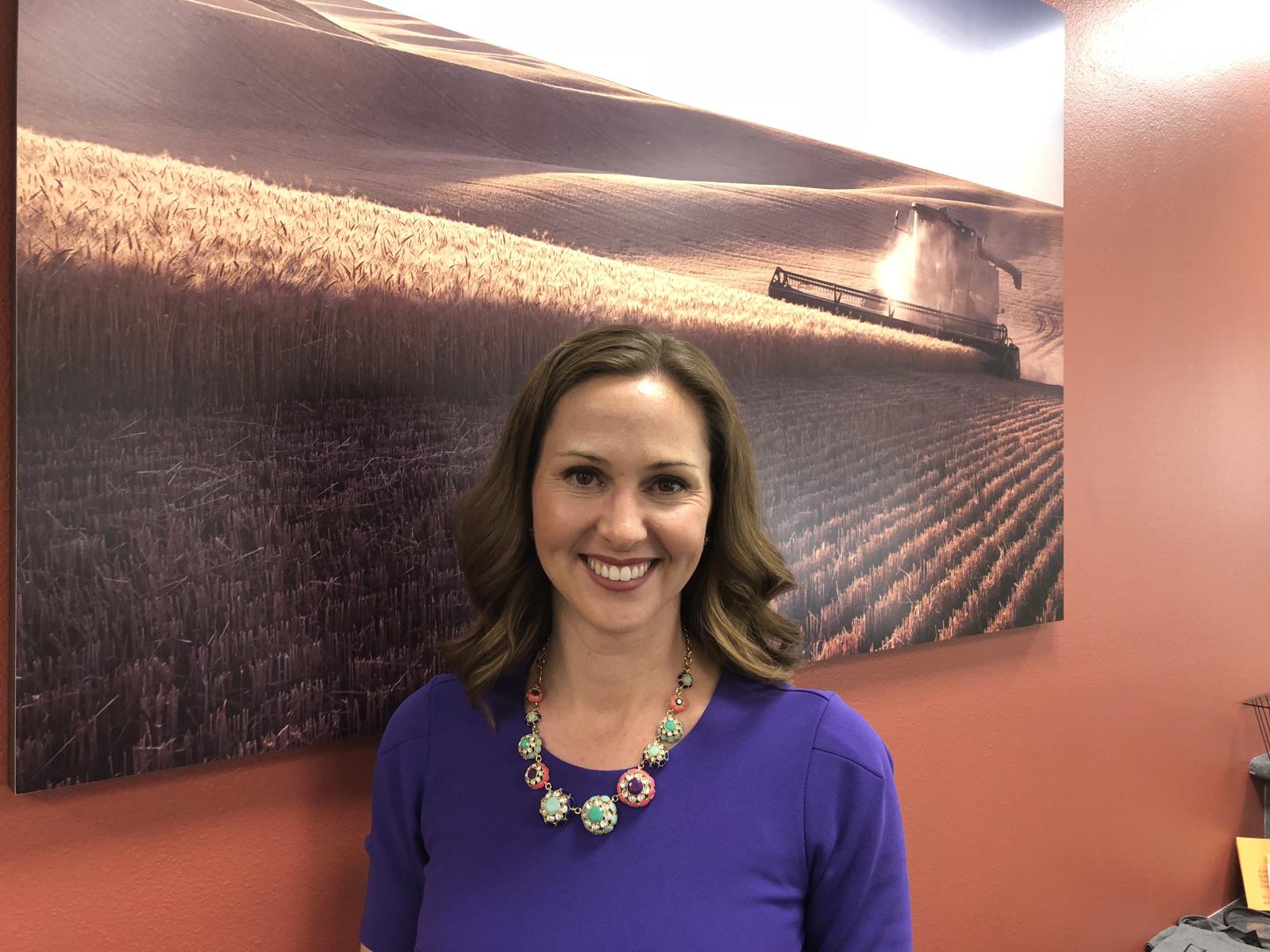 Casey Chumrau, the new executive director of the Idaho Wheat Commission, is shown here in the IWC building in Boise.