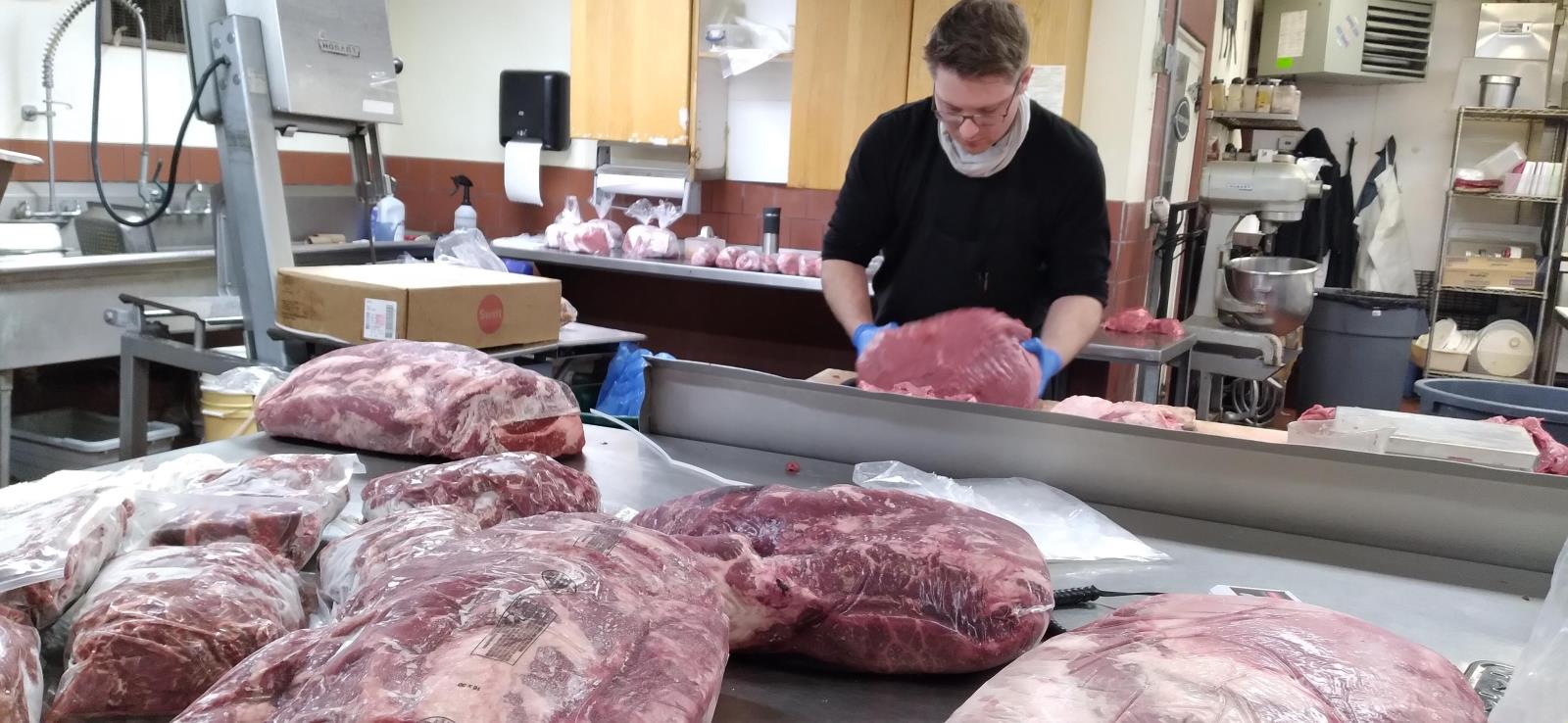 Barry Jacobson cuts beef at Del Monte Meats in Pocatello. Cattle industry experts are bullish on cattle prices in 2021. 