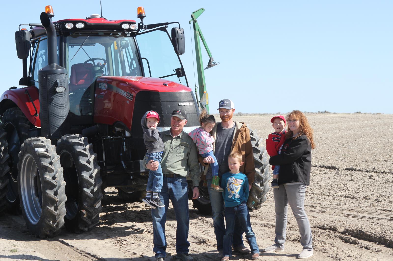 Members of the Call family are shown in front of a tractor on the family farm west of American Falls April 7. According to a recent report by USDA’s National Agricultural Statistics Service, 96 percent of the nation’s two million farms are family owned and operated.