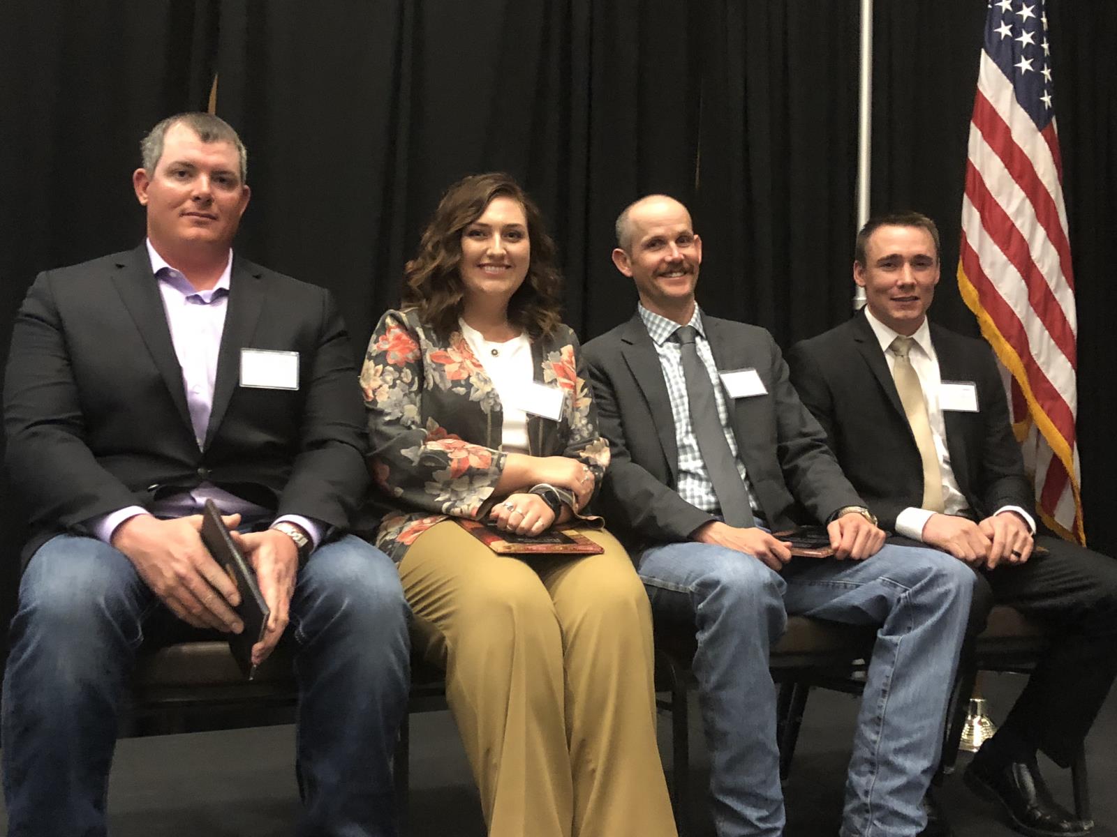 From left, Sedar Beckman, Saydee Longhurst, Rob Cope and Kenny Dalling receive young producer awards March 13 during the Eastern Idaho Agriculture Hall of Fame’s annual induction ceremony.